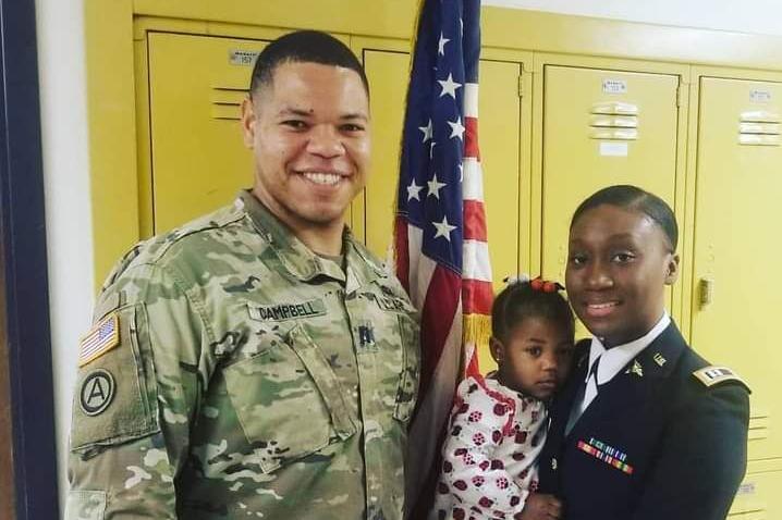 Keontra Campbell with his wife and daughter Lailah during his wife's promotion ceremony